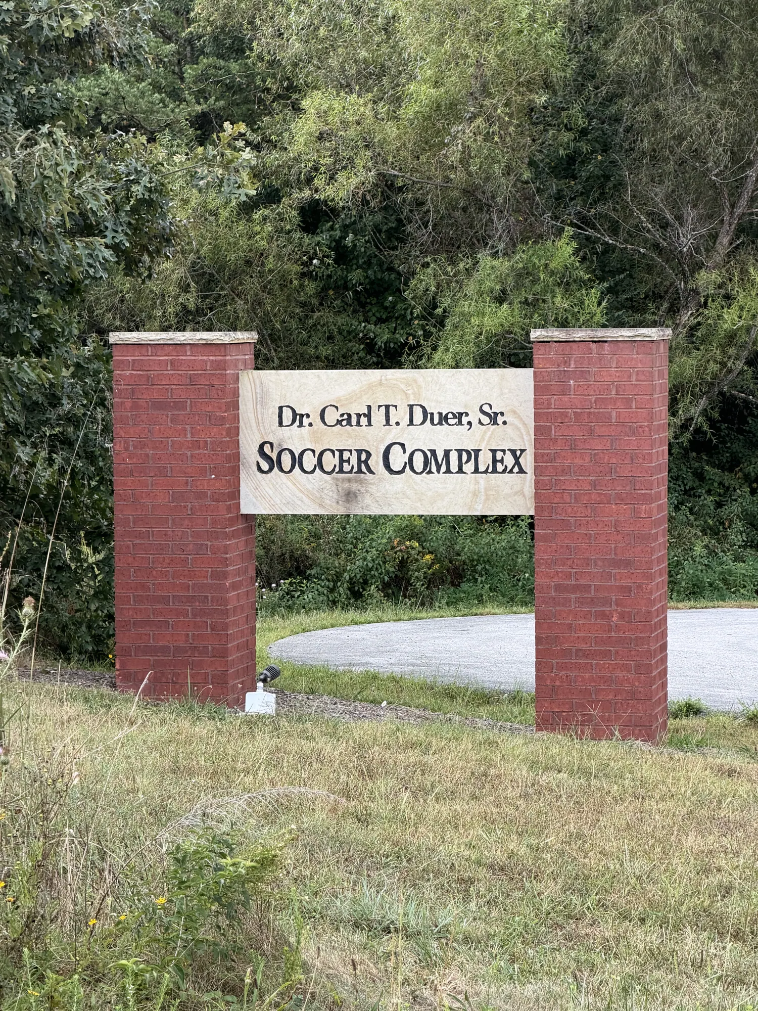 The brick entrance sign of the Dr. Carl T. Duer, Sr. Soccer Complex